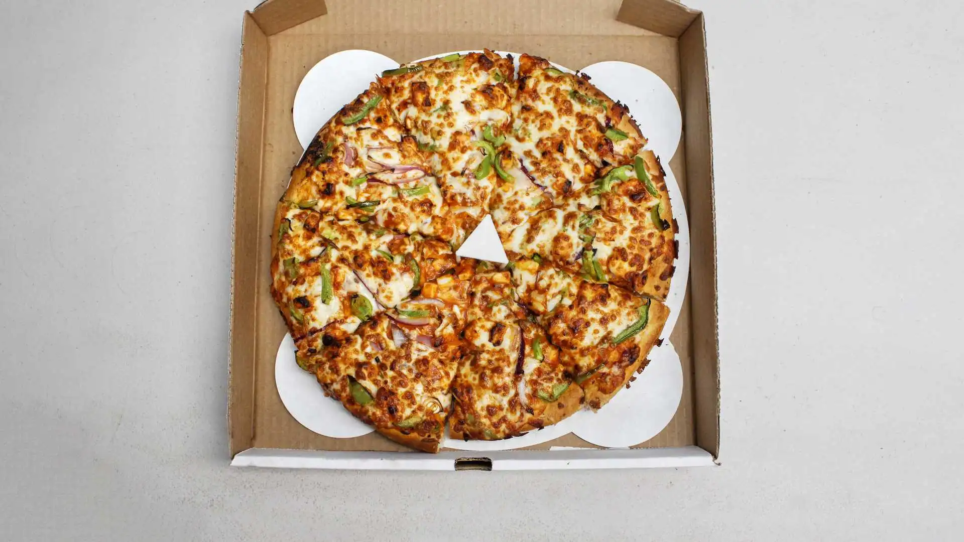 Shahi Paneer Pizza - Organic Indian-style pizza with paneer cheese at Boss Pizza Edmonton